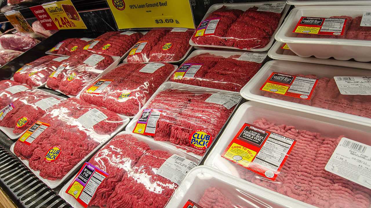 Frozen meat products at a grocery store.
