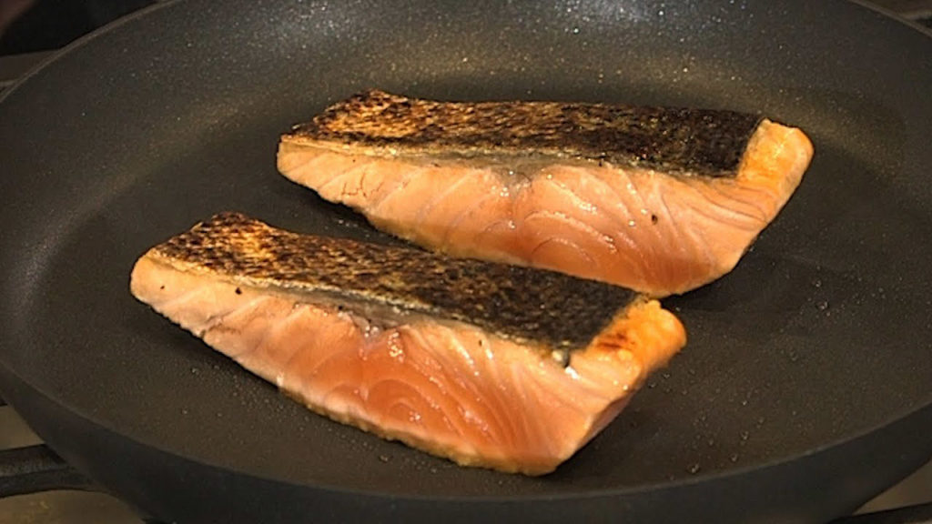Seared salmon in a skillet