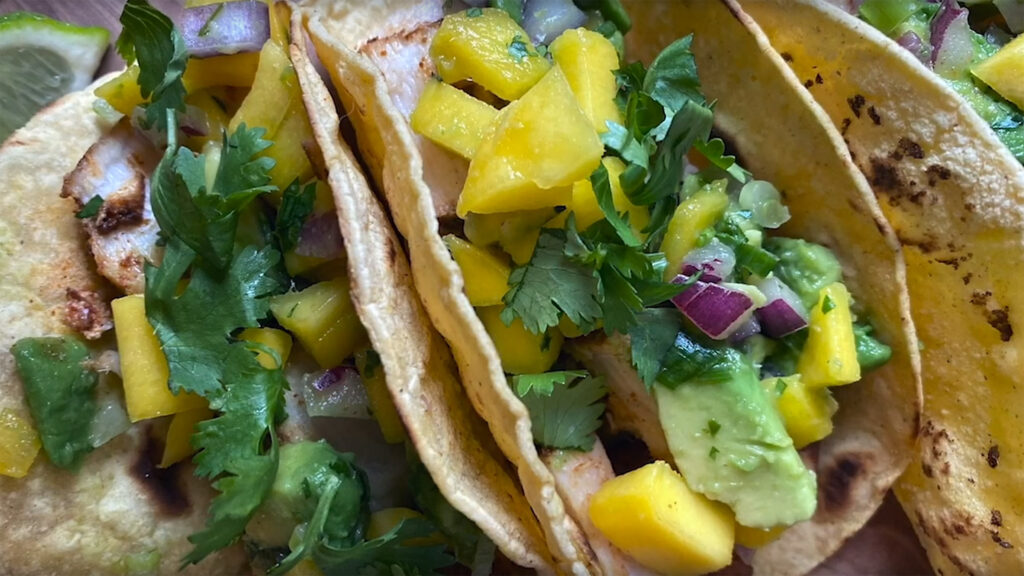 Close-up of fish tacos with avocado mango salsa